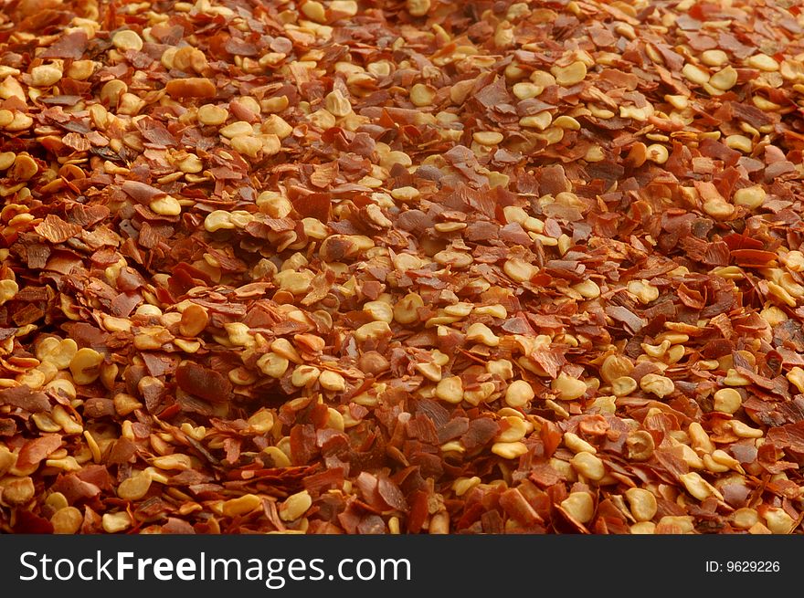 Close up of crushed red pepper flakes. Close up of crushed red pepper flakes.