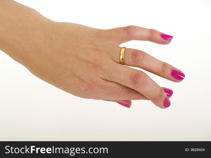 Womans hand with painted fingernails fingers crossed wearing a weding ring