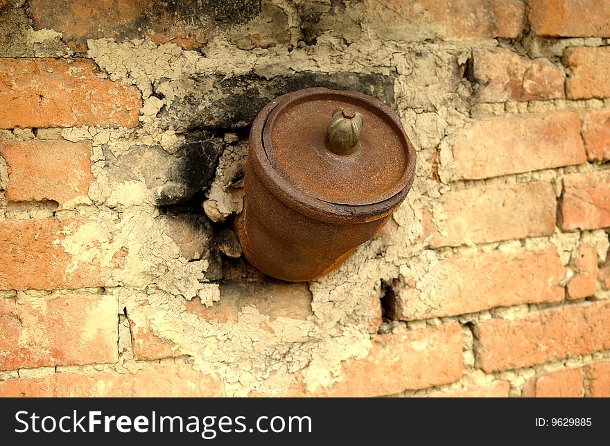 Old rusted chimney in the wall