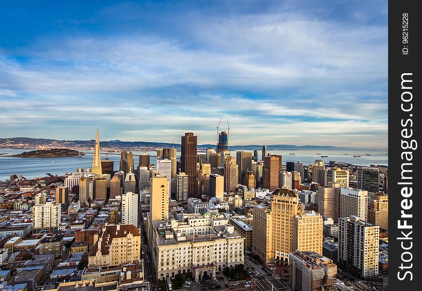 High Angle View of Cityscape Against Cloudy Sky