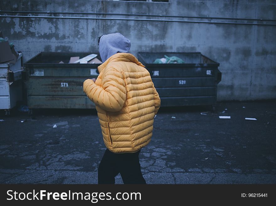 Person in Yellow Puffer Jacket Walking