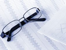 Glasses On Financial Figures. Royalty Free Stock Photography Glasses On Financial Figures. Royalty Free Stock Photography