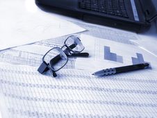 Laptop, Glasses And Pen On Financial Documents. Royalty Free Stock Photos Laptop, Glasses And Pen On Financial Documents. Royalty Free Stock Photos