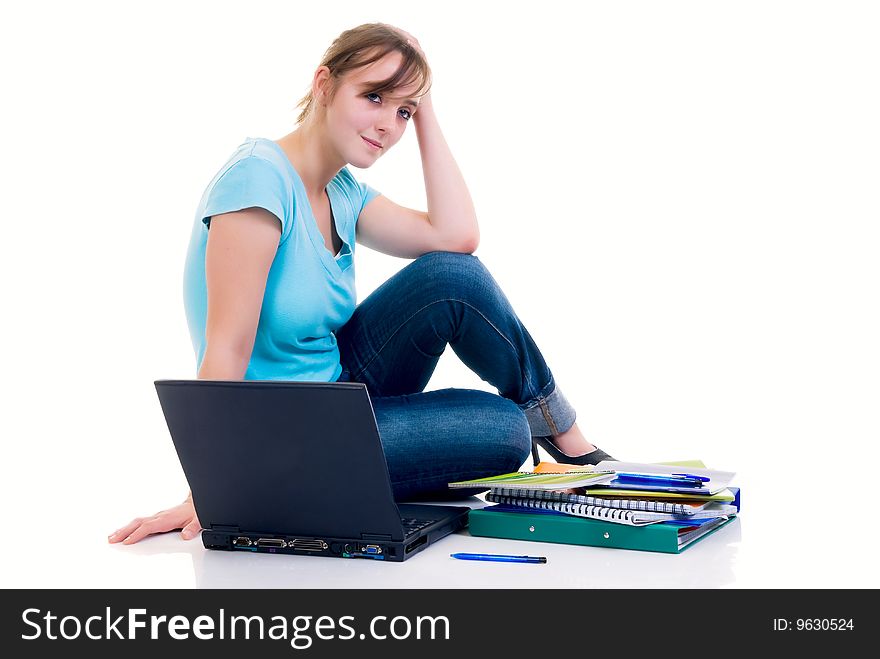 Teenager schoolgirl with laptop on white background