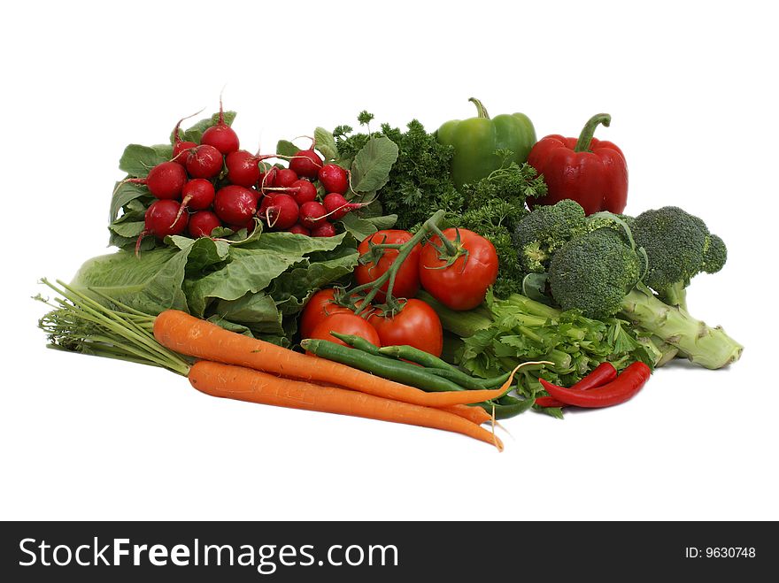 An arrangement of various vegetables on white background. An arrangement of various vegetables on white background.