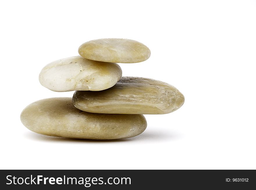 A horizontal image of carefully balanced stacked beige river rocks