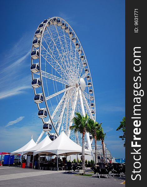 Ferrish wheels on the blue sky background