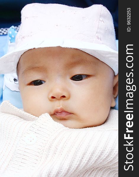 It is a cute chinese baby, isolated. he is 5 months. It is a cute chinese baby, isolated. he is 5 months