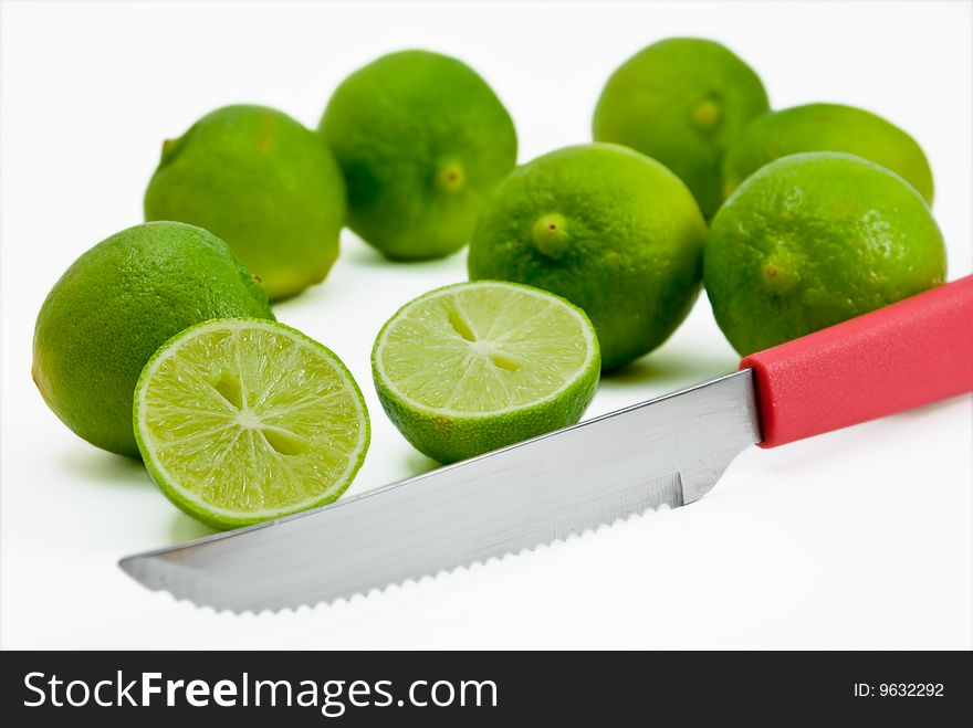 Limes being cut by red knife