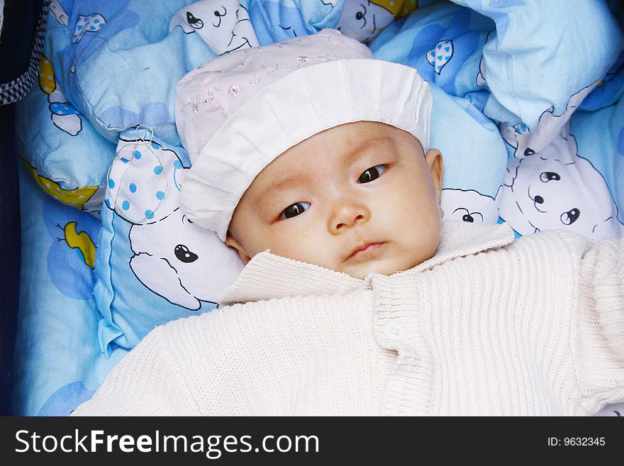 It is a cute chinese baby, isolated. he is 5 months. It is a cute chinese baby, isolated. he is 5 months