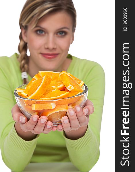 Woman with oranges on white background, focus on orange. Woman with oranges on white background, focus on orange