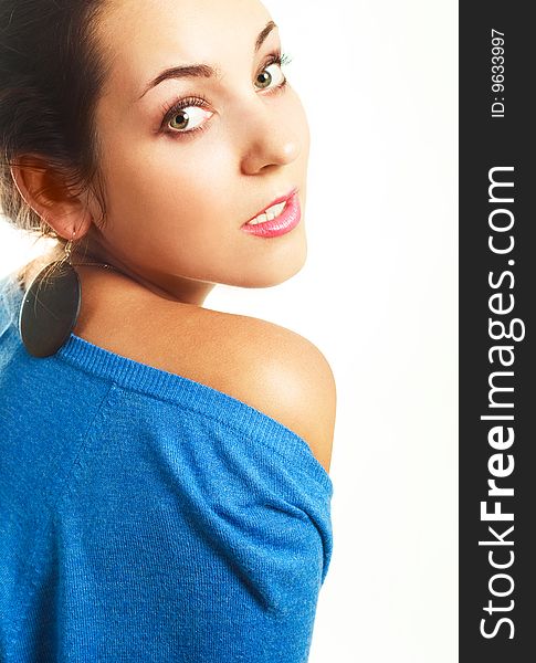 Portrait of a beautiful young brunette woman against white background