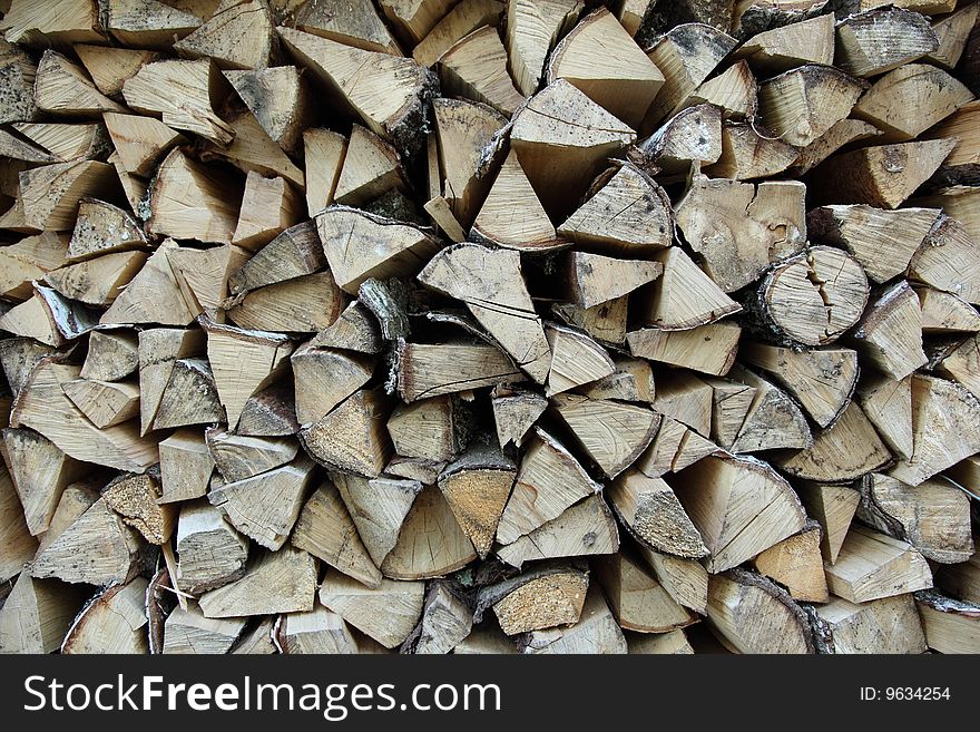 Lots of firewood orderly stacked