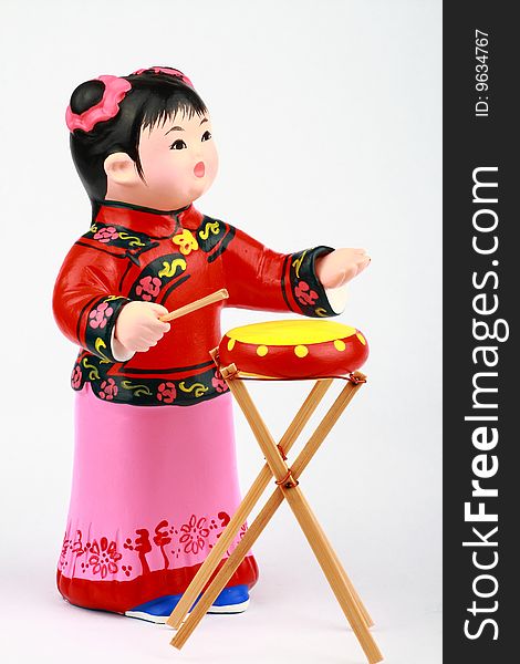 Clay Figure Of Asian Girl Playing Drum