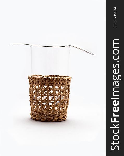 A glass in a wickery basket