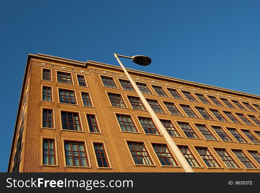 Abstract office Building with windows, blue sky background ....