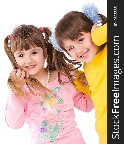 Two happy little girls on white background. Two happy little girls on white background
