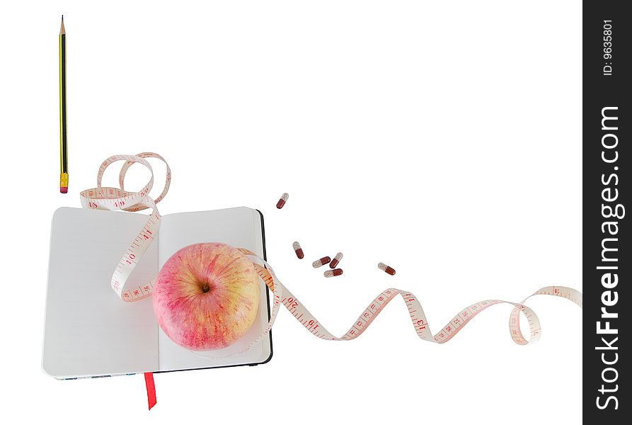 Diary With Apple And Pills For Effective Dieting