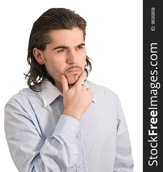 Young thoughtful dark haired caucasian man in light blue striped shirt isolated on white. Young thoughtful dark haired caucasian man in light blue striped shirt isolated on white