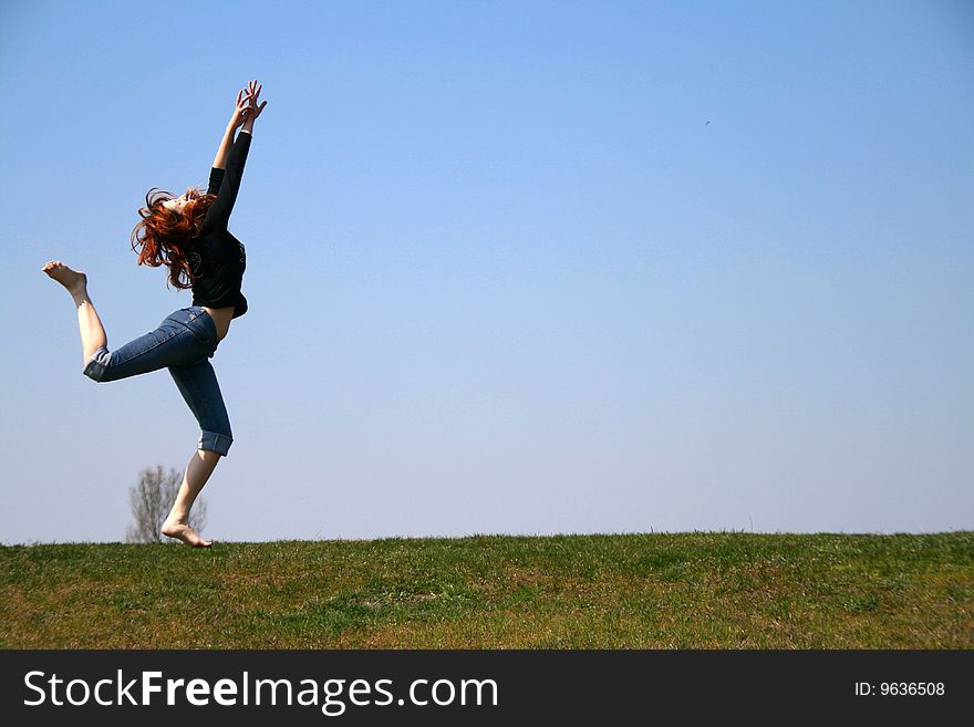 The girl taken in a jump like hanging in the air. The girl taken in a jump like hanging in the air