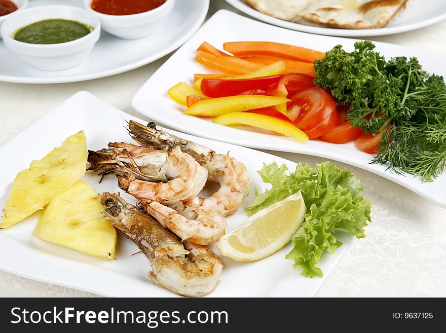 Fried shrimps decoration pineapple and greenery