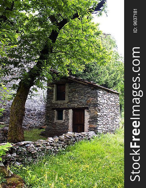 Grass with old stone hut. Grass with old stone hut