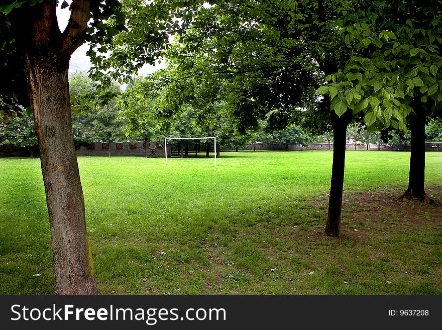 Football field surrounded by green