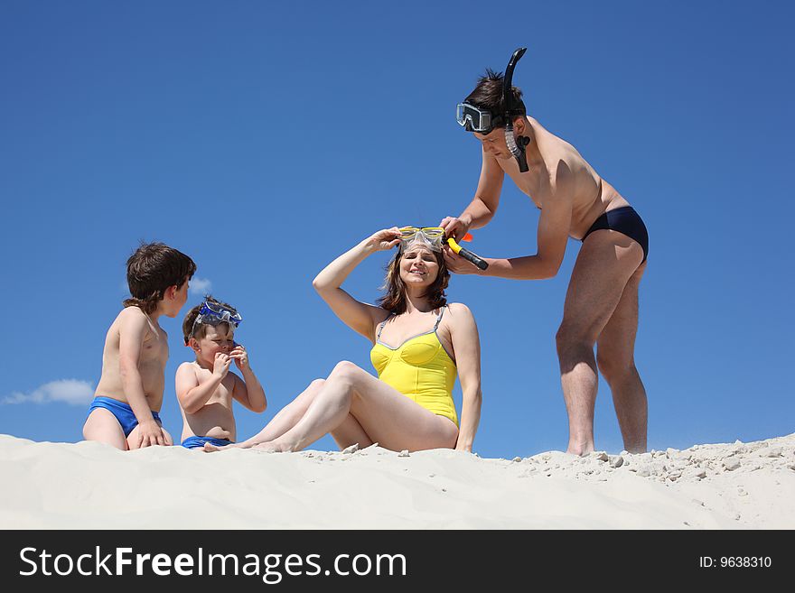 Family going to swim with snorkeling masks