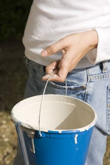 Woman Holding Paint Bucket Stock Image