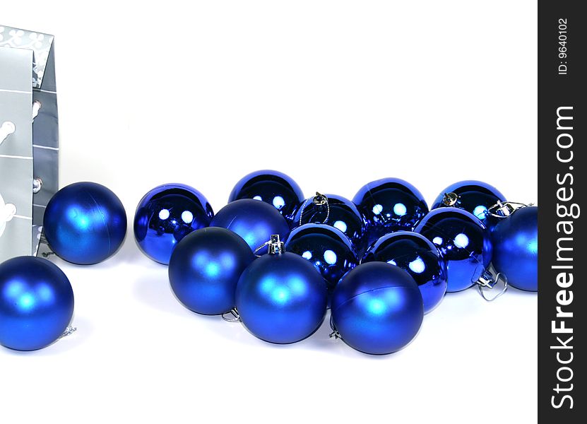 Spilled blue ornaments on white background. Spilled blue ornaments on white background