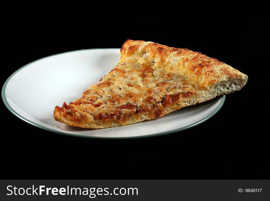 Slice of cheese pizza on a plate with black background