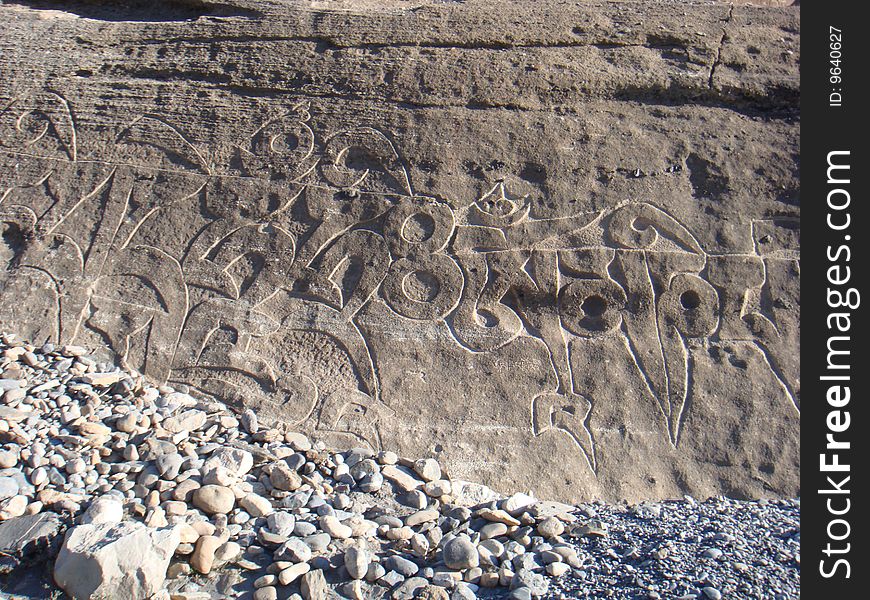 Prayer mantra on a rocks