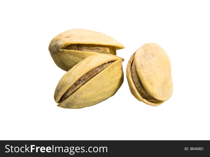 Macro shot of pistachios isolated on white