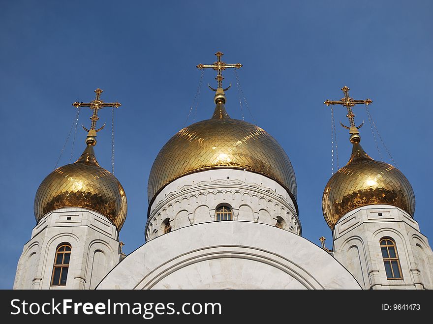 Crosses of orthodox church against blue sky
