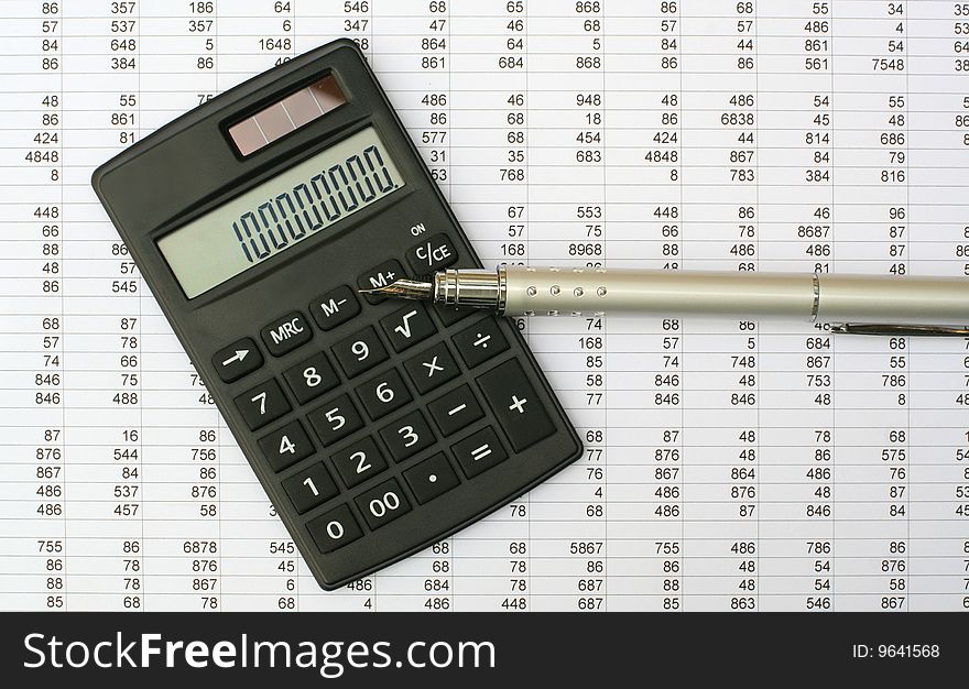 Calculator and pen on a white background. Calculator and pen on a white background