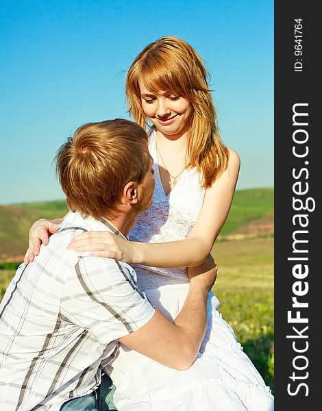 Happy young loving couple outdoor in summertime