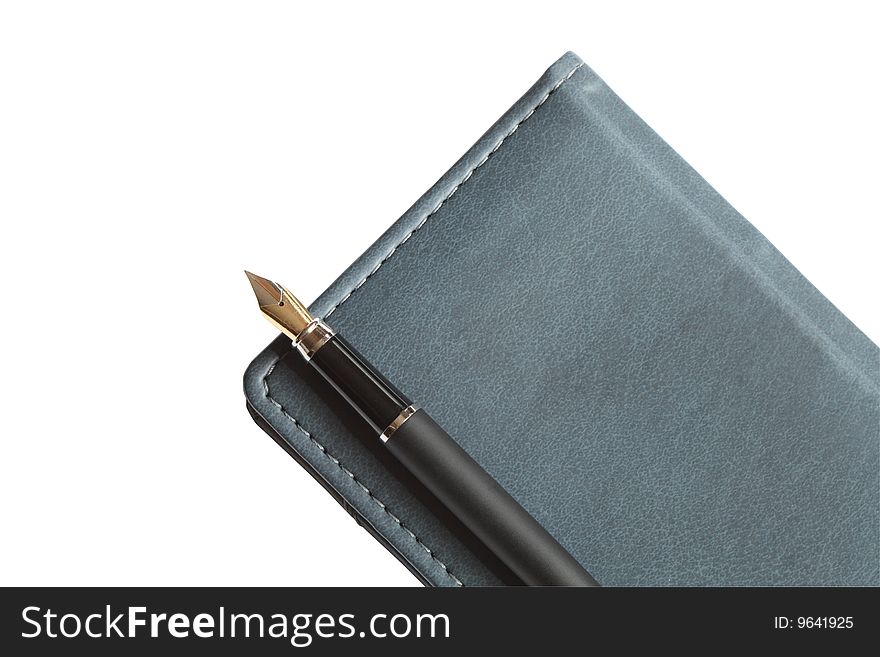 Fountain pen lying on leather notebook isolated with clipping path. Fountain pen lying on leather notebook isolated with clipping path