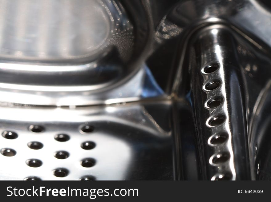 Abstract metal dark background with lot of small round holes standing in row. Abstract metal dark background with lot of small round holes standing in row