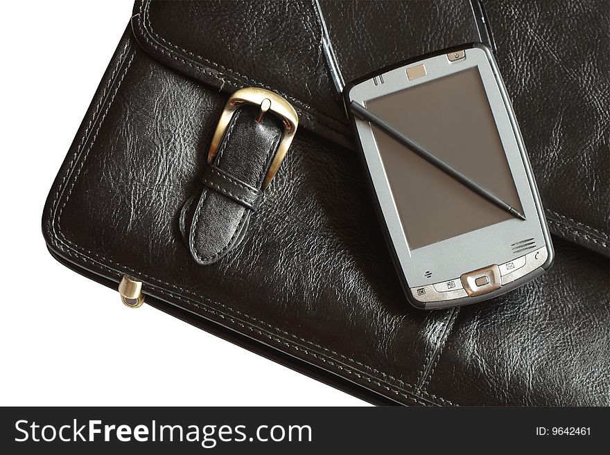 Pocket computer lying on black leather brief case isolated with clipping path