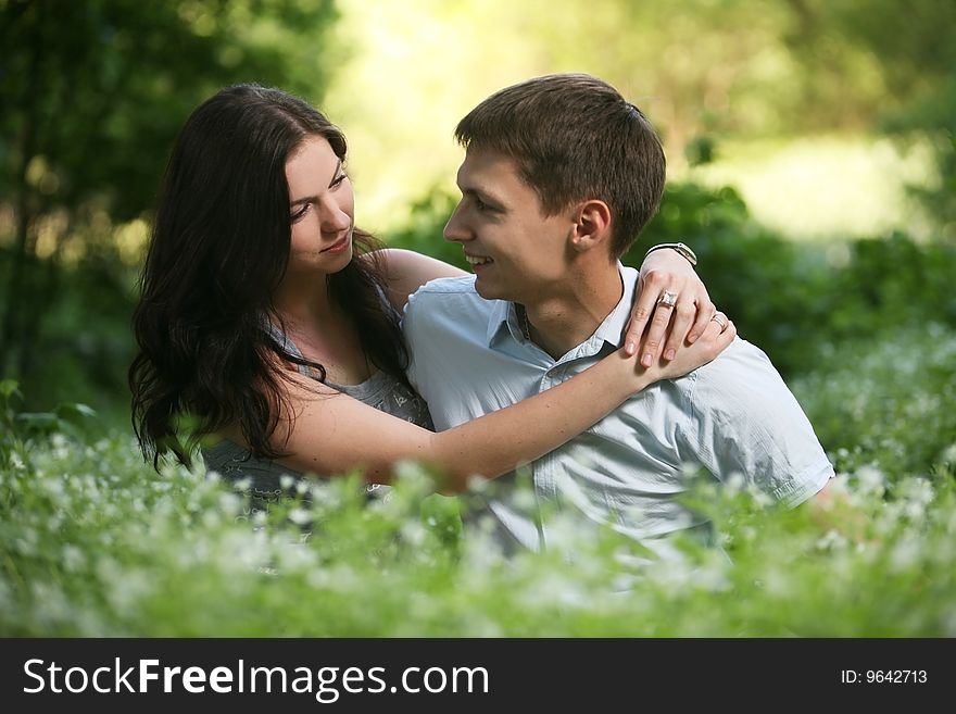 Man and woman sitting on the grass. Man and woman sitting on the grass.