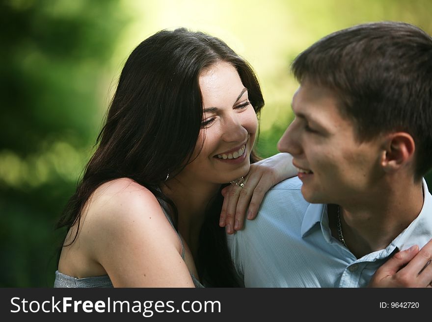 Man and woman sitting on the grass. Man and woman sitting on the grass.