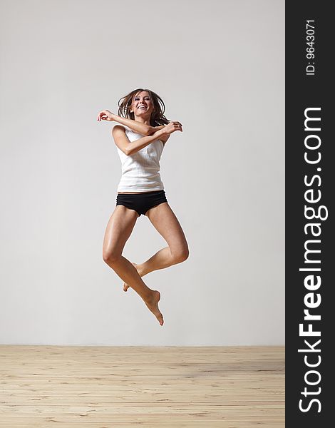 Modern style dancer posing on studio background. Modern style dancer posing on studio background