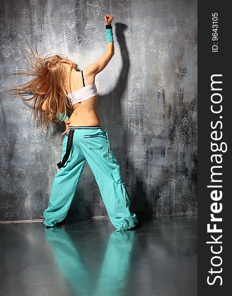 Modern style dancer posing on studio background. Modern style dancer posing on studio background