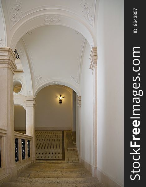 Classic stairway with arch in castle