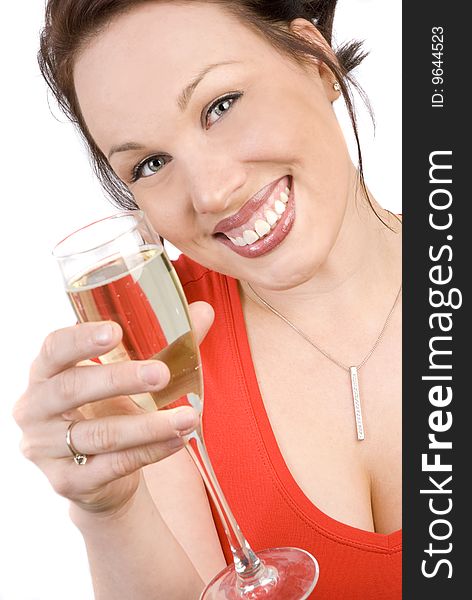 Happy brunette with a glass of champagne isolated on white