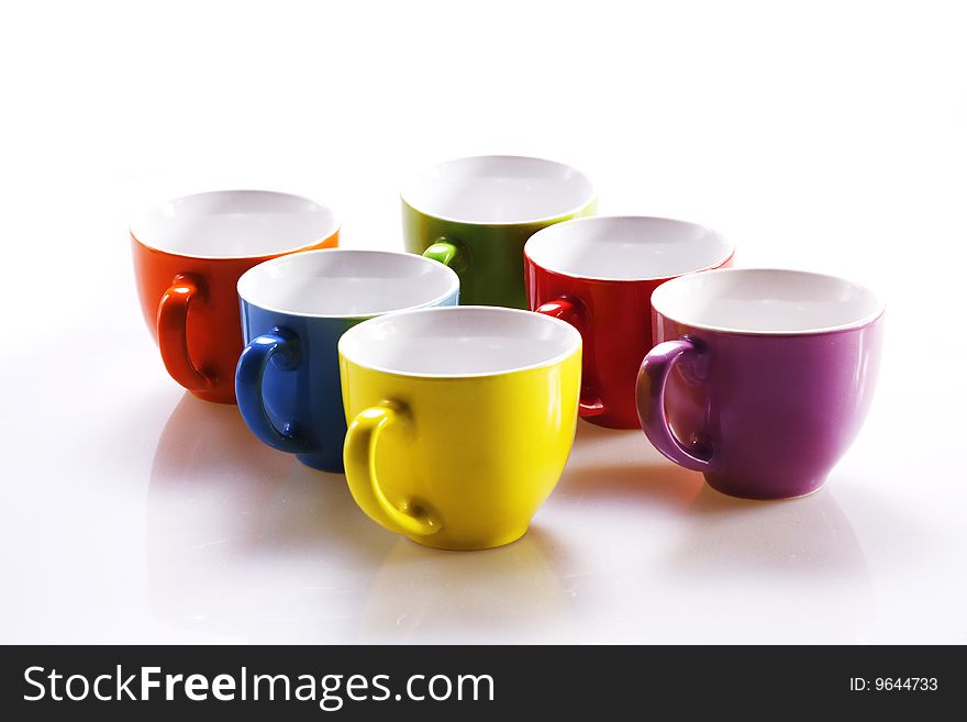 Colorful cups isolated on white background