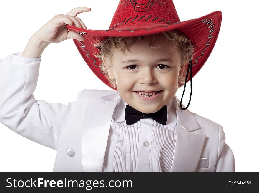 A smiling boy in a rad stetson (hat)