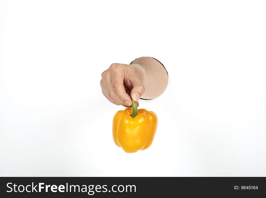 Man's hand is holding paprika. Man's hand is holding paprika