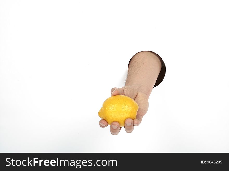 Yellow lemon in man's hand. Yellow lemon in man's hand