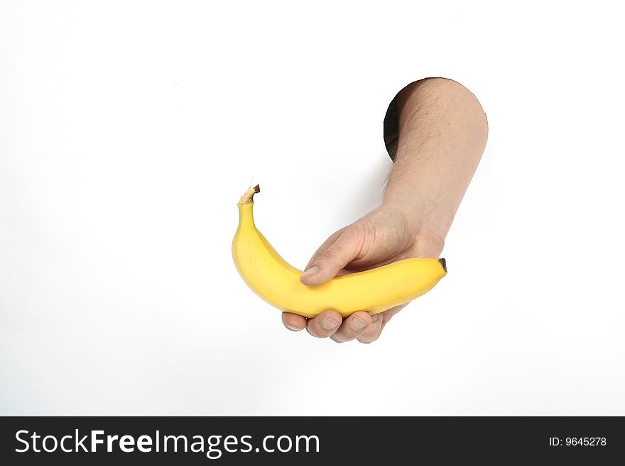 yellow banana in man's hand